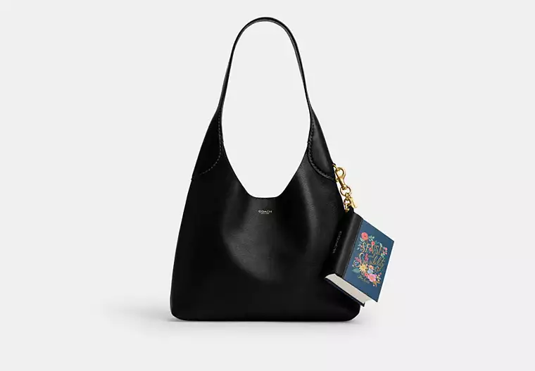 Book Charms de Coach